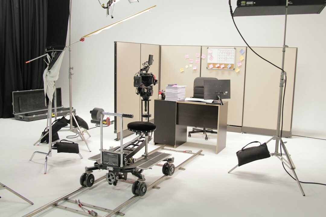 Television newsroom with editing desks and screens