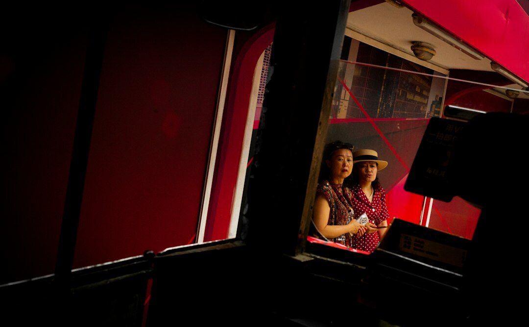 Two broadcast engineers reviewing footage on a monitor